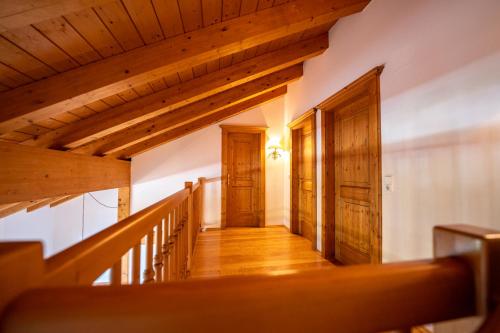 a hallway in a house with wooden ceilings at Zugspitz Resort in Ehrwald