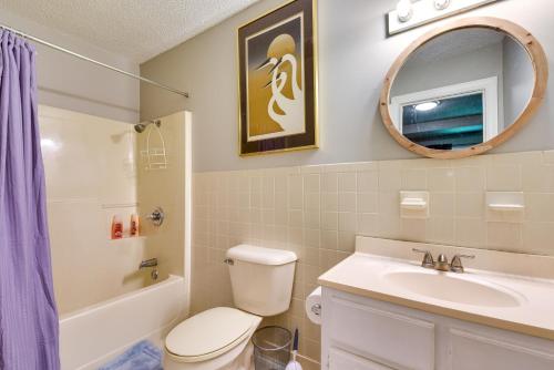 a bathroom with a toilet and a sink and a mirror at Charming Rome Home - Steps from Historic Downtown! in Rome