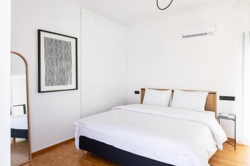 Postel nebo postele na pokoji v ubytování Elliot Neapoli, Athens