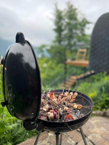 a grill with many different types of food on it at Woodhide - Cottages near Batumi, Georgia in Zeda Ch'khutunet'i