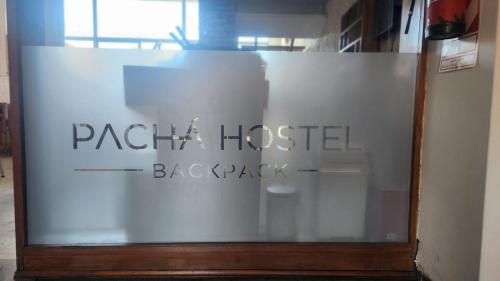 a glass window with the words packet houston blackpack at Pachá Hostel Backpack in Salta