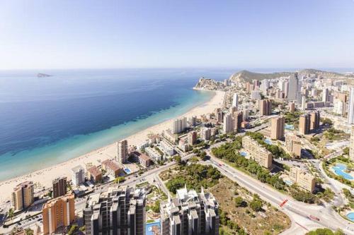 an aerial view of a beach and the ocean at Luxury apartment Residencial Sunset Drive - Benidorm, España in Benidorm