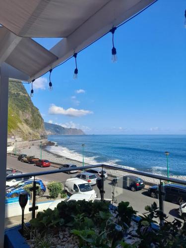 a view of the ocean from the balcony of a building at Mediterrâneo Madeira in São Vicente