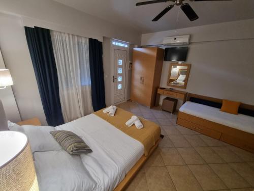 Ένα ή περισσότερα κρεβάτια σε δωμάτιο στο GreenHill Holiday Suites