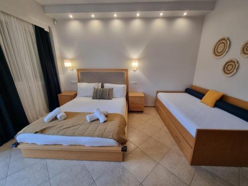Ένα ή περισσότερα κρεβάτια σε δωμάτιο στο GreenHill Holiday Suites