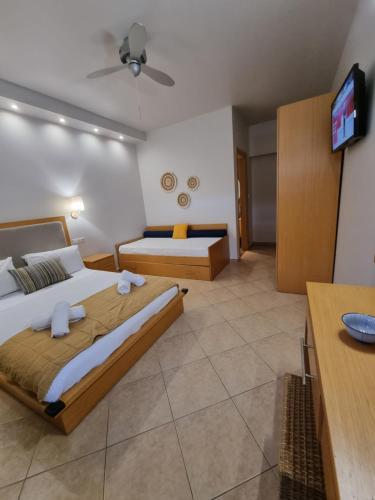 Ένα ή περισσότερα κρεβάτια σε δωμάτιο στο GreenHill Holiday Suites