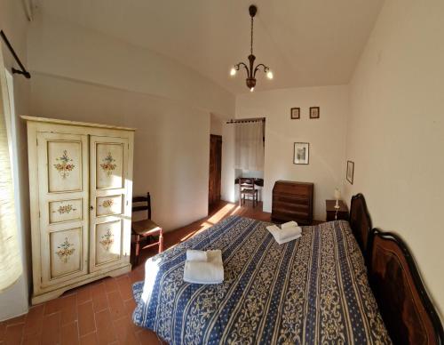 a bedroom with a bed with two pillows on it at ABBAZIA DI VALLINGEGNO in Gubbio