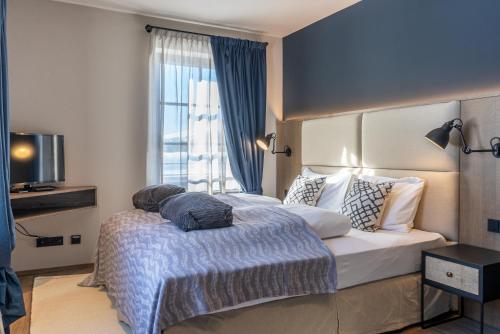 Кровать или кровати в номере HERBERT - Boutique Apartments inkl Lungau Card