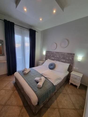 Ένα ή περισσότερα κρεβάτια σε δωμάτιο στο GreenHill Holiday Suites