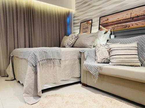 Кровать или кровати в номере FLAT ILHA DO LEITE - DENTRO PÓLO MÉDICO