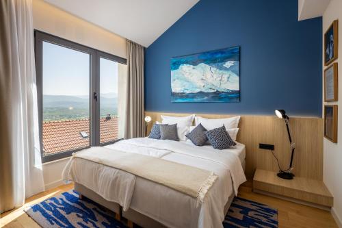 Postel nebo postele na pokoji v ubytování Emotheo Heritage Hotel
