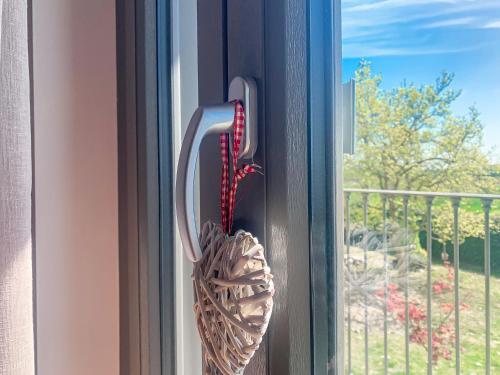a window opener is hanging on a window at Villa Albina in La Loggia