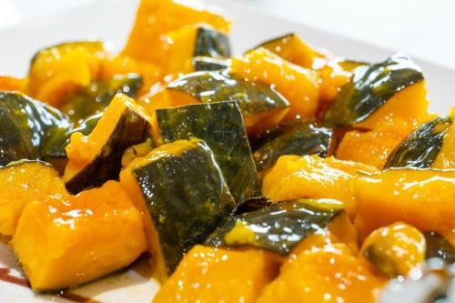 a plate of food with mangoes and other vegetables at Hotel Sun in Takasaki