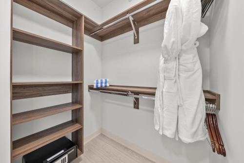a walk in closet with wooden shelves at Level Chicago - Fulton Market in Chicago