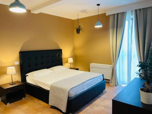 Postel nebo postele na pokoji v ubytování Conti B&B Suite Ponte Amato