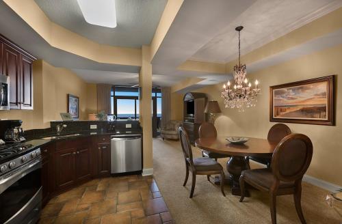 a kitchen with a table and a dining room at North Beach Resort & Villas in Myrtle Beach