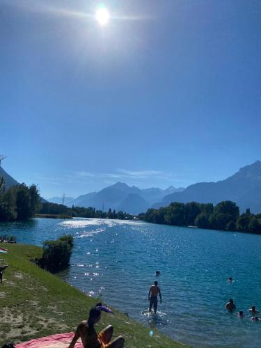 a group of people in the water at a lake at Le Preyet in Veysonnaz