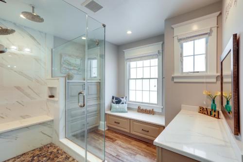 a bathroom with a shower and a glass shower stall at Waterfront Ocean City Escape with Large Deck, Pool! in Ocean City