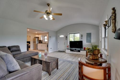 a living room with a couch and a tv at Second-Floor Harveys Lake Apartment with Deck! in Harveys Lake