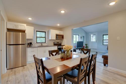 a kitchen and dining room with a table and chairs at Second-Floor Harveys Lake Apartment with Deck! in Harveys Lake
