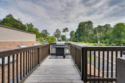 a wooden walkway with a grill on it at Second-Floor Harveys Lake Apartment with Deck! in Harveys Lake