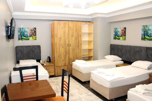 Ένα ή περισσότερα κρεβάτια σε δωμάτιο στο biglife hotel