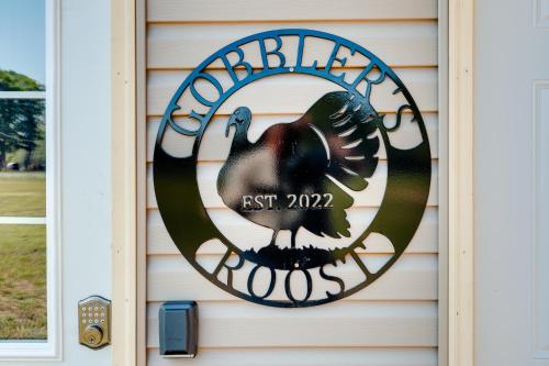 a sign on a house with a turkey on it at Toivola Home with Fire Pit 8 Mi to Lake Superior! in Toivola