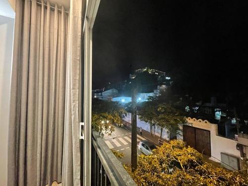 a view of a city street at night from a building at Kandy City Inn in Kandy