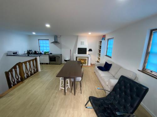 a living room with a couch and a table at SEA Villa Rosa Charm Seaside and Garden in Porto