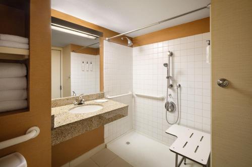 a bathroom with a sink and a shower at Fairfield Inn & Suites Denver Cherry Creek in Denver