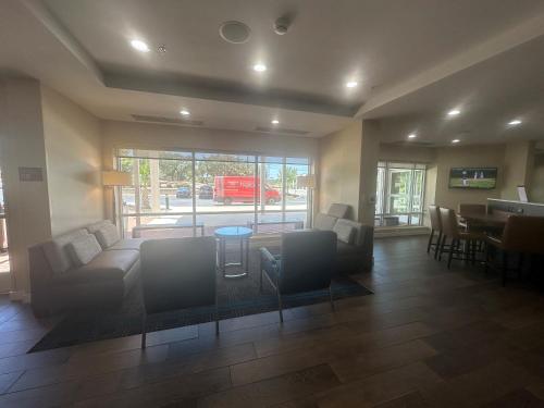 a living room with a couch and chairs and a table at TownePlace Suites by Marriott San Antonio Westover Hills in San Antonio