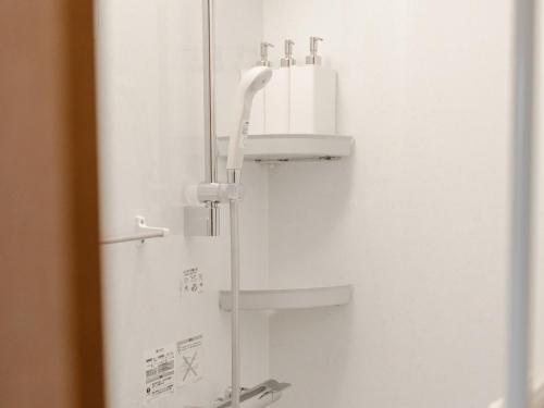 a bathroom with a sink and a shower at Bond Building 3F - Vacation STAY 45724v in Wakayama