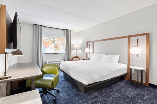 a hotel room with a bed and a desk at Fairfield Inn & Suites by Marriott Hickory in Hickory