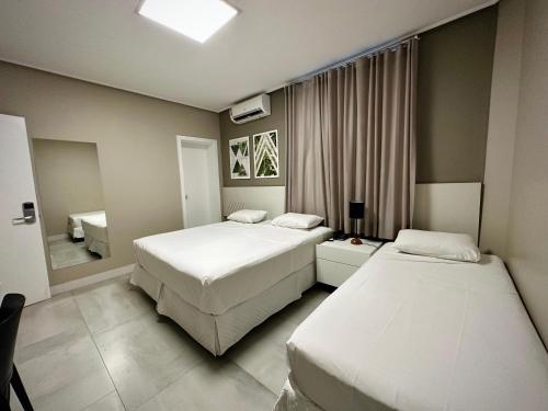 Giường trong phòng chung tại DM HOTEL