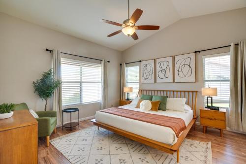 a bedroom with a bed and a ceiling fan at Modern Peoria Home with Pool Access and Private Yard! in Peoria