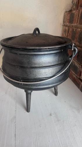 a black pot sitting on top of a table at The Donga House - Luxury Home near Scottburgh Beach in Scottburgh