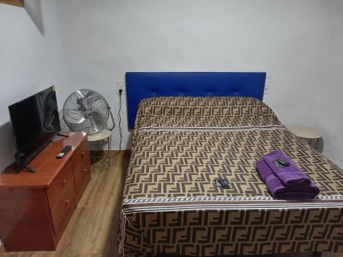 A bed or beds in a room at Cantarranas