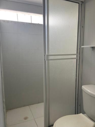 a bathroom with a shower and a toilet at HospedajeLR in Barrancabermeja