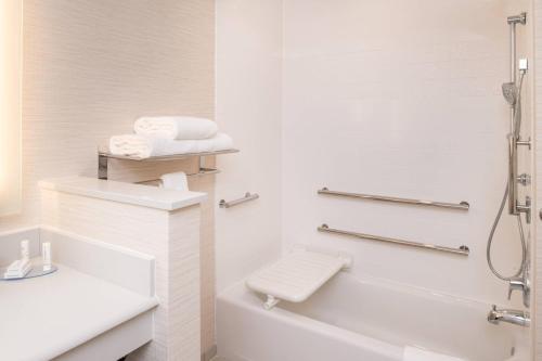 a bathroom with a sink and a tub and a toilet at Fairfield Inn & Suites by Marriott Akron Stow in Stow