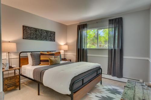 a bedroom with a bed and a window at @ Marbella Lane - Eccentric 4BR Modern Ranch Home in Reno