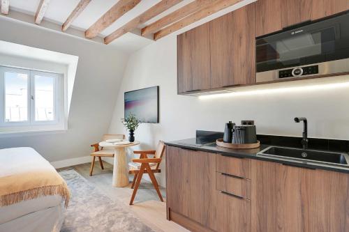 a kitchen with a sink and a counter top at Amazing studio - Louvre Place Vendome in Paris