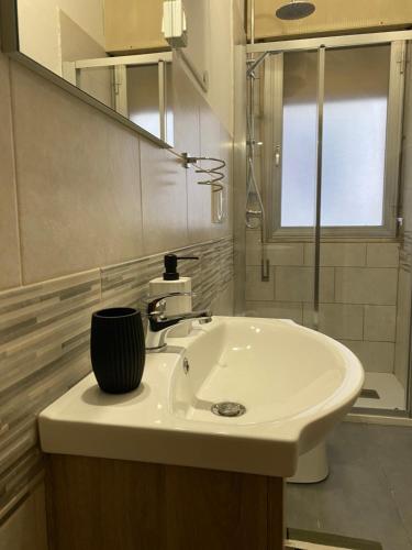 a white bathroom with a sink and a shower at venice popular residence in Mestre