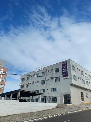 a large building on the side of a street at Ok Inn Hotel Floripa in Florianópolis