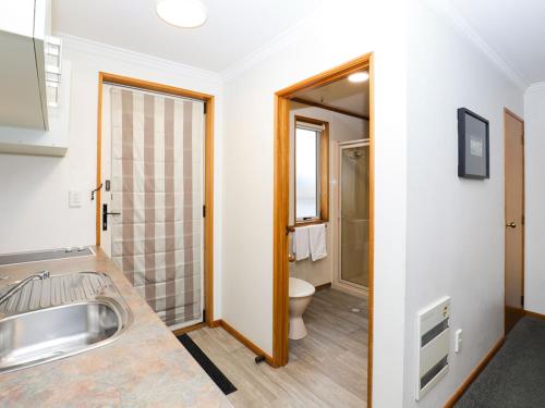 a bathroom with a sink and a toilet at ASURE Chelsea Gateway Motor Lodge in Westport