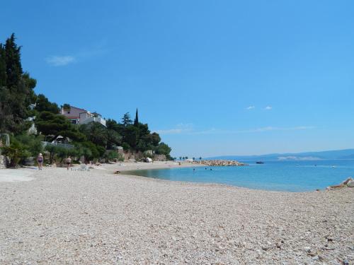 a view of a beach with people in the water at Villa Maristika in Omiš