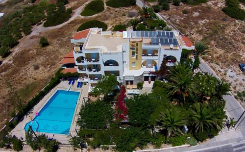 an aerial view of a house with a swimming pool at Sarikampos Beach in Myrtos