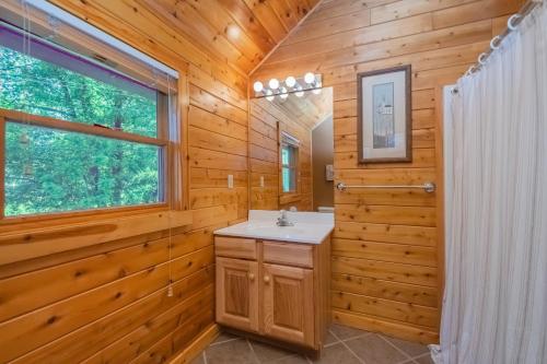 a bathroom with a sink and a window at Mallard Landing in McHenry