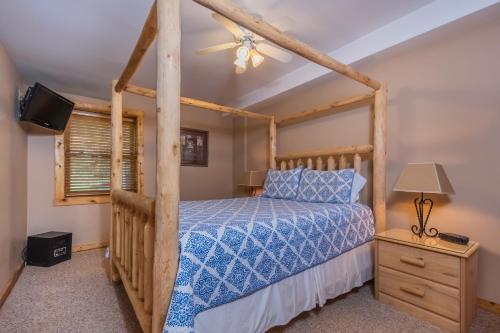 a bedroom with a bed and a ceiling fan at Mallard Landing in McHenry