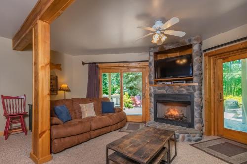 a living room with a couch and a fireplace at Mallard Landing in McHenry