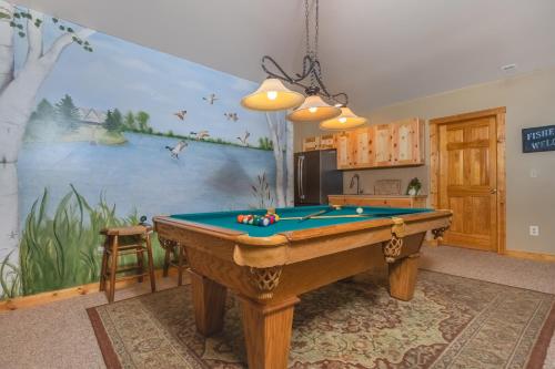 a kitchen with a pool table in a room at Mallard Landing in McHenry